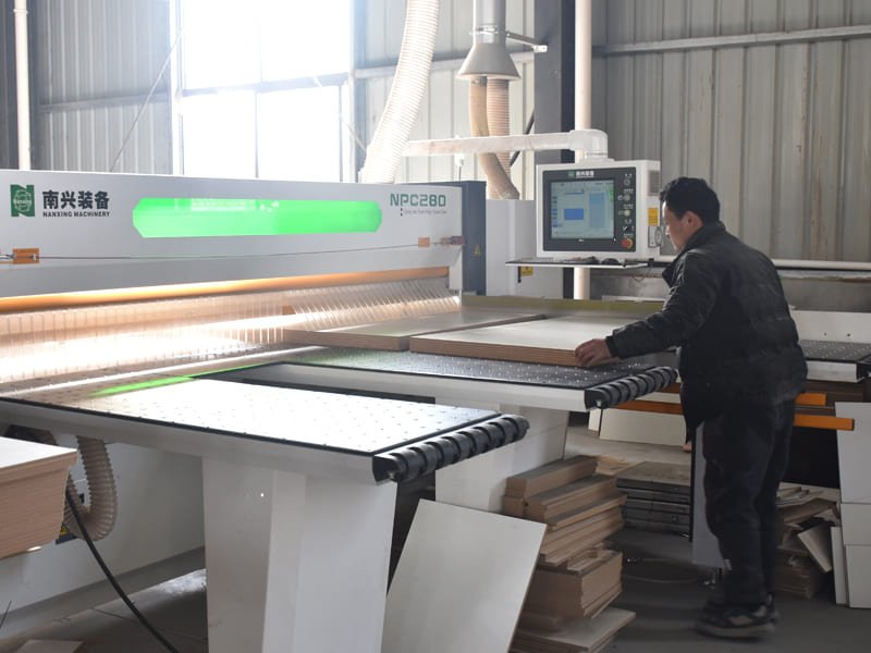 High-precision CNC machining and shaping workshop with automated woodworking machines cutting and shaping wooden furniture components.