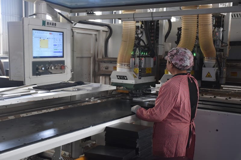 Industrial MDF production line showing wood fiber processing, pressing, and finishing stages