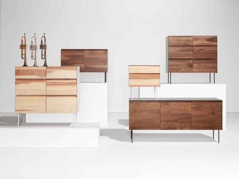 Contemporary light wood-grain chipboard desk and shelving unit with clean lines, showcasing affordable flat-pack furniture assembly.