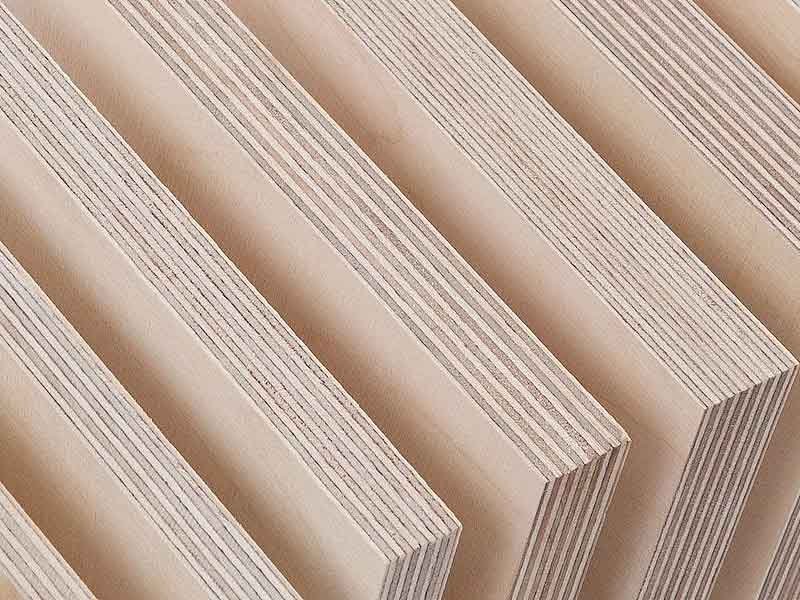 Chart explaining plywood grading standards with quality indicators and grade types for construction.