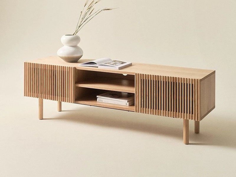 Modern plywood furniture set featuring chairs and a table in a minimalist living room.