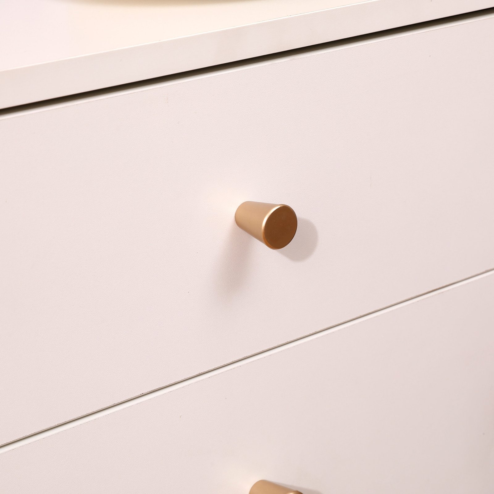 Modern wooden bed side table with drawer in cozy bedroom decor.